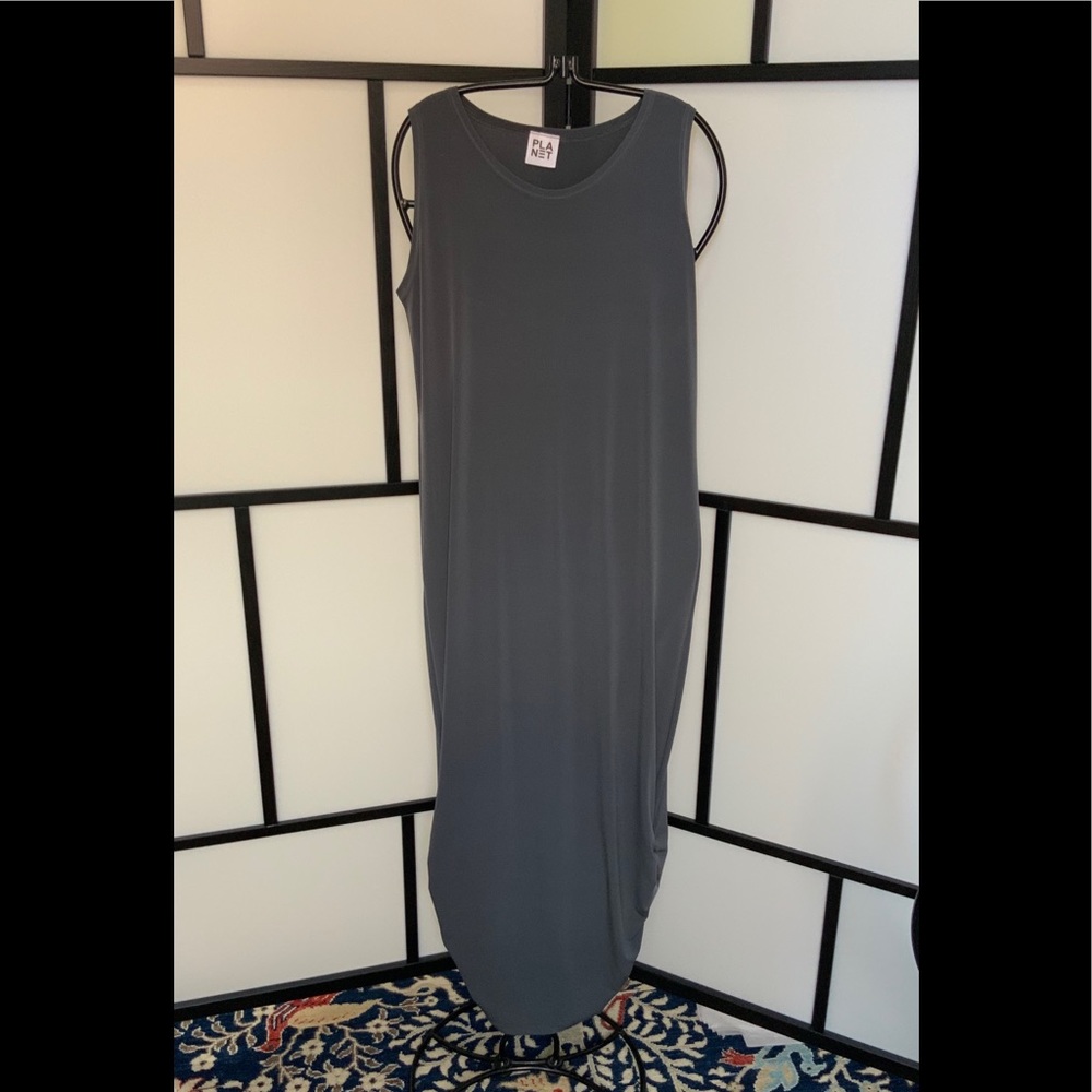 NWOT Dress with Unique Ruched Sides at hem.